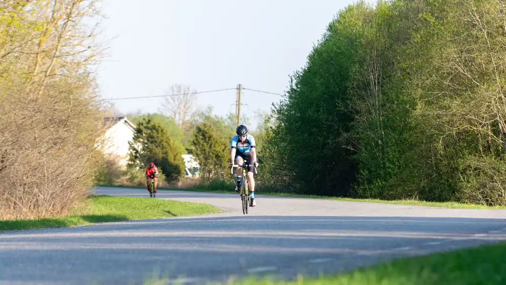 Cyclists riding on a quiet country road