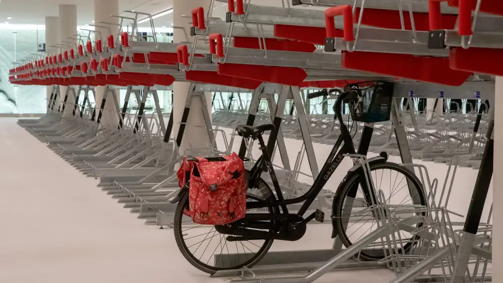 Bikes stored on a floor rack indoors