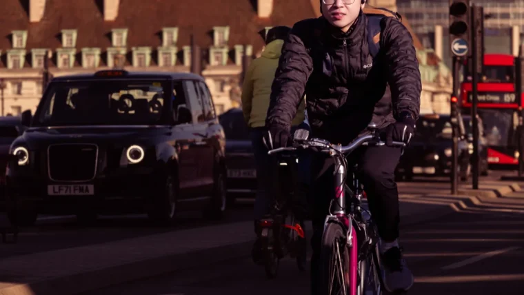 Cyclist commuting on a quiet city street in the UK