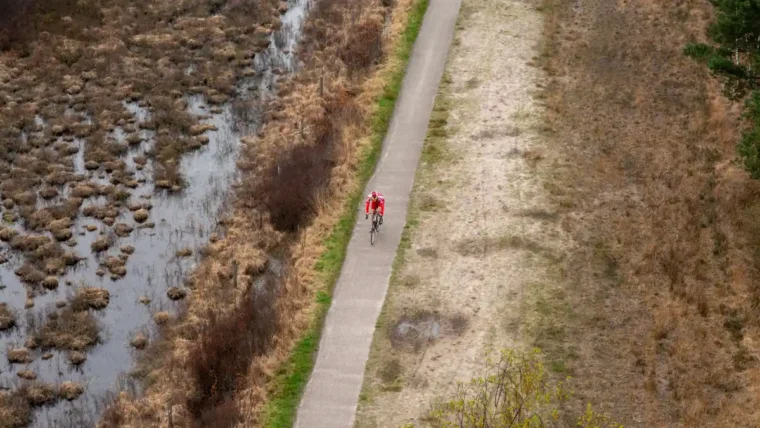 Cyclist riding on a dedicated cycle path, part of the National Cycle Network in the UK