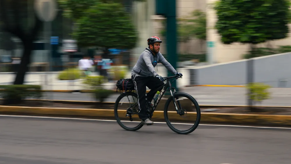 Man cycling to work on a commuter bike