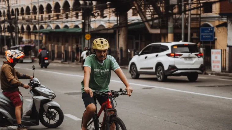 Cyclist wearing a helmet on an urban commute in the UK