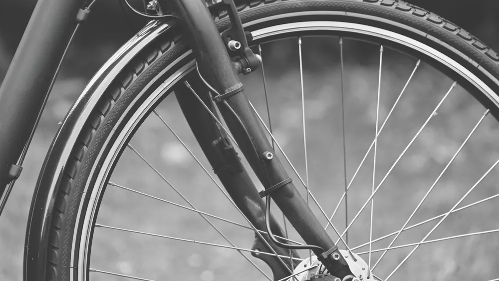 Close-up of mudguard fitted on a commuter bike wheel