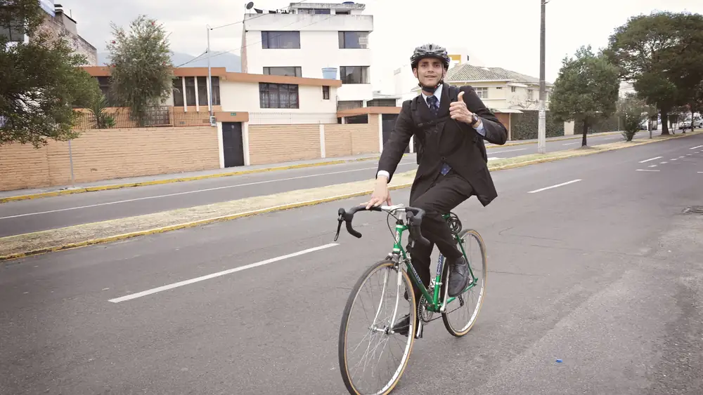 Commuter cyclist riding through city on a weekday morning