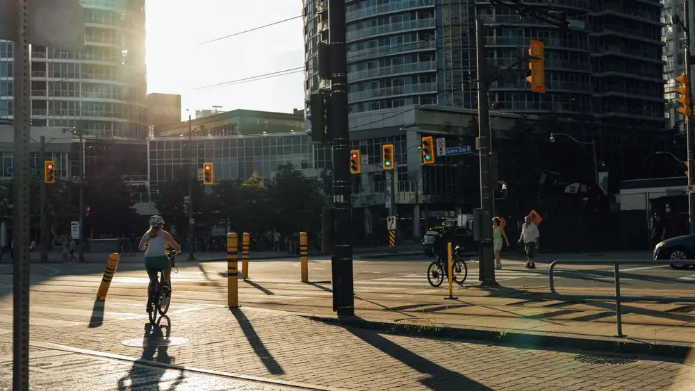 Cyclist waiting at an Advanced Stop Line (bike box) at a UK traffic light