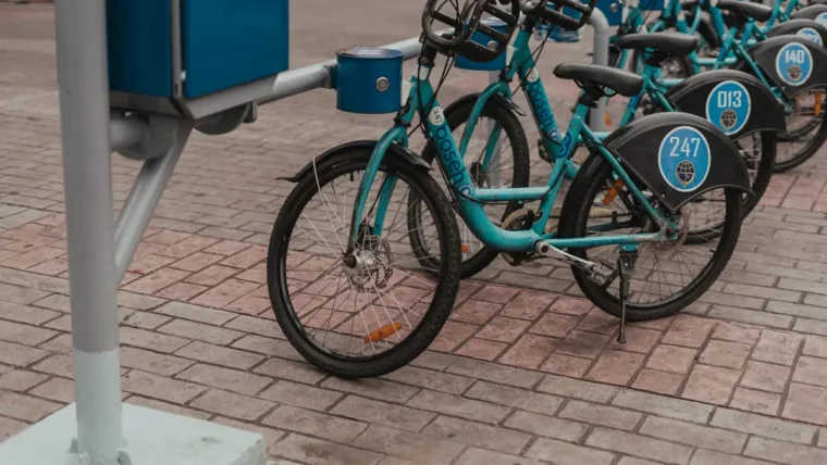 Shared hire bikes lined up at a bike share station